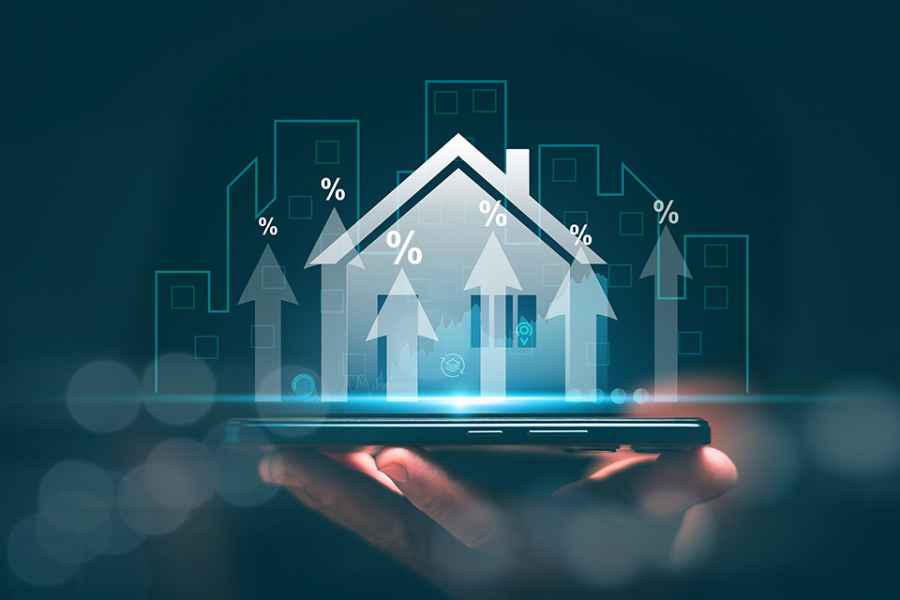 Foto: Hologramm eines Hauses auf einer Hand